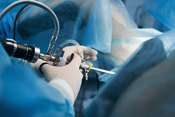 Photo of surgeons using technical medical equipment